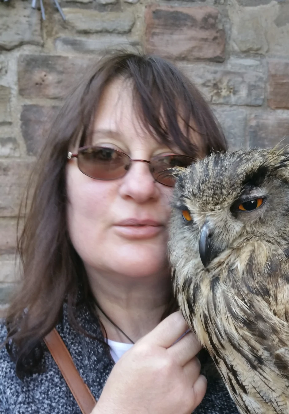 Illustrator Angie Jenkins pictured alongside an owl.